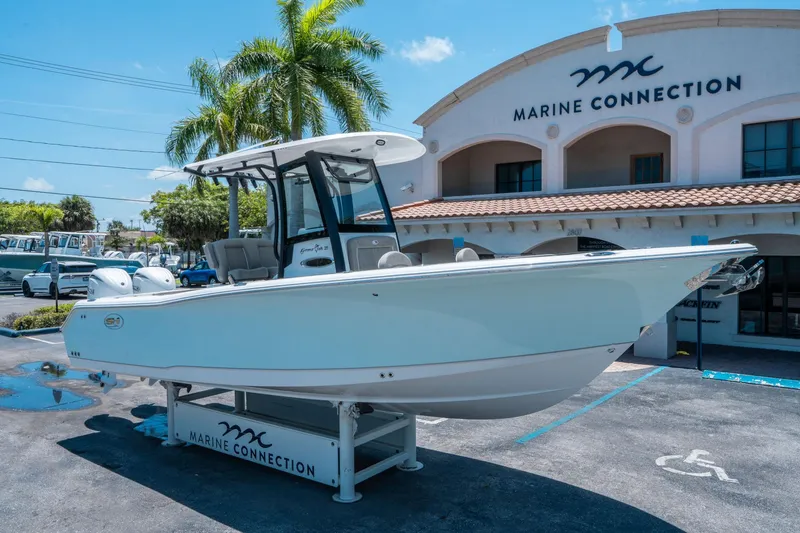 Slide: The Image of 2025 Sea Hunt Gamefish 25 boat displayed at Marine Connection dealership. - 8