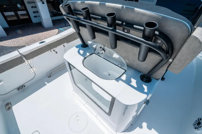 Slide: The Image of 2025 Sea Hunt Gamefish 25 boat interior with rod holders and sink. - 15