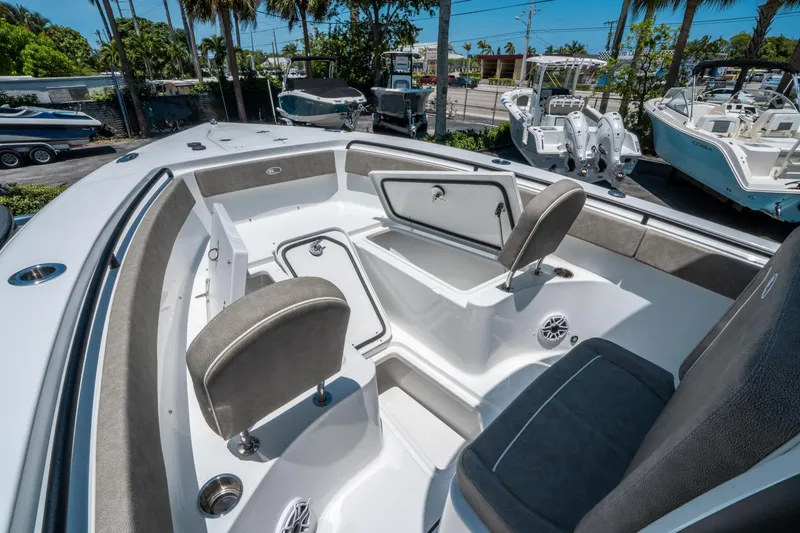 Slide: The Image of 2025 Sea Hunt Gamefish 25 boat interior with seating and storage compartments. - 28