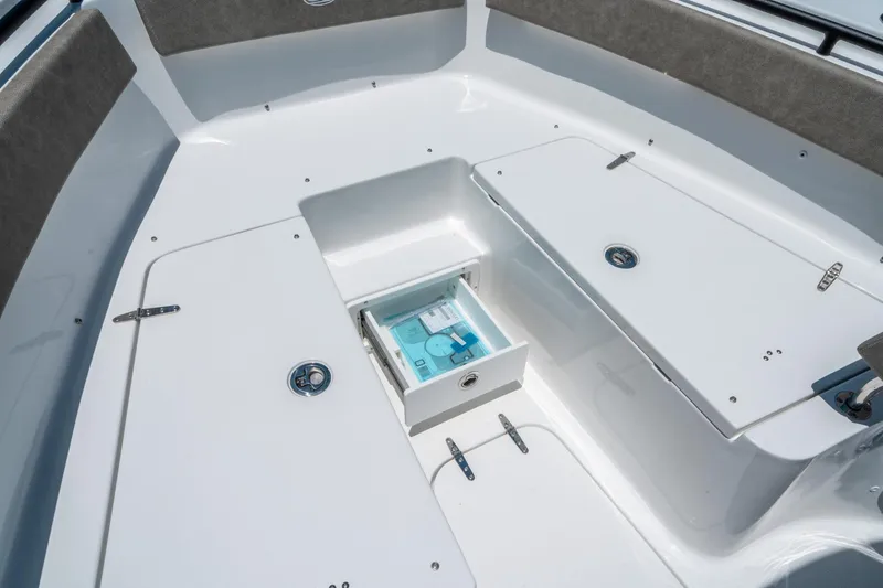 Slide: The Image of 2025 Sea Hunt Gamefish 25 boat interior with storage compartments and seating. - 29