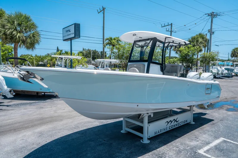 Slide: The Image of 2025 Sea Hunt Gamefish 25 boat displayed at Marine Connection dealership. - 6