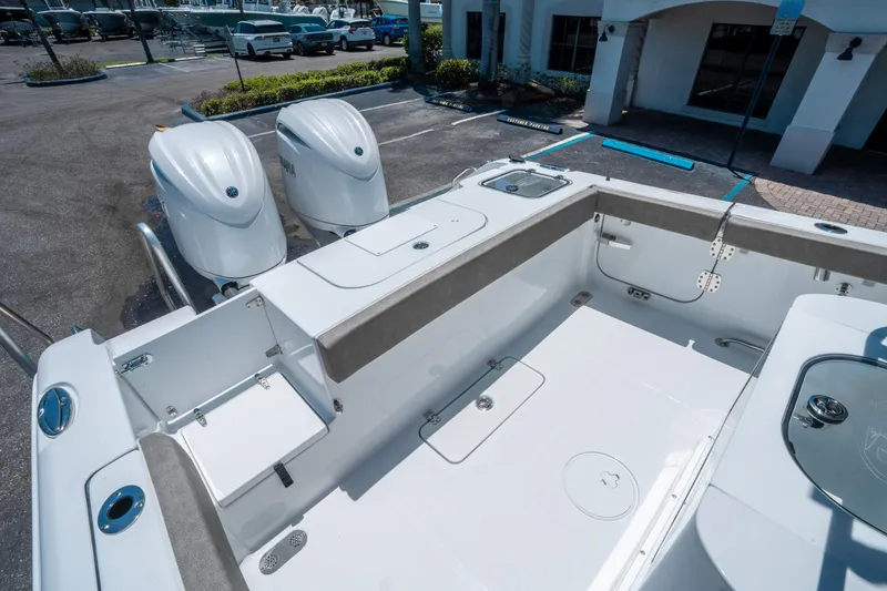 Slide: The Image of 2025 Sea Hunt Gamefish 25 boat interior with dual engines, spacious deck, and storage compartments. - 11