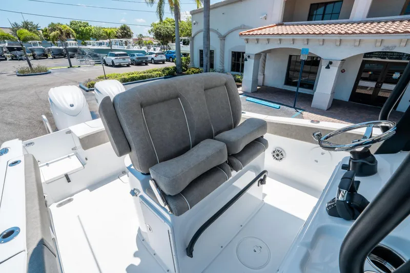 Slide: The Image of 2025 Sea Hunt Gamefish 25 boat interior with dual seats and steering wheel. - 21