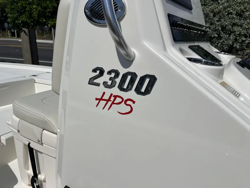 Slide: The Image of 2025 Pathfinder 2300 HPS boat console with seating and control panel. - 12