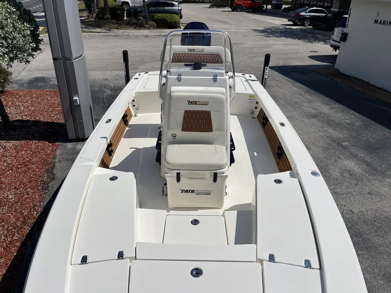 Slide: The Image of 2025 Pathfinder 2300 HPS boat, white deck, center console, outdoor display. - 15
