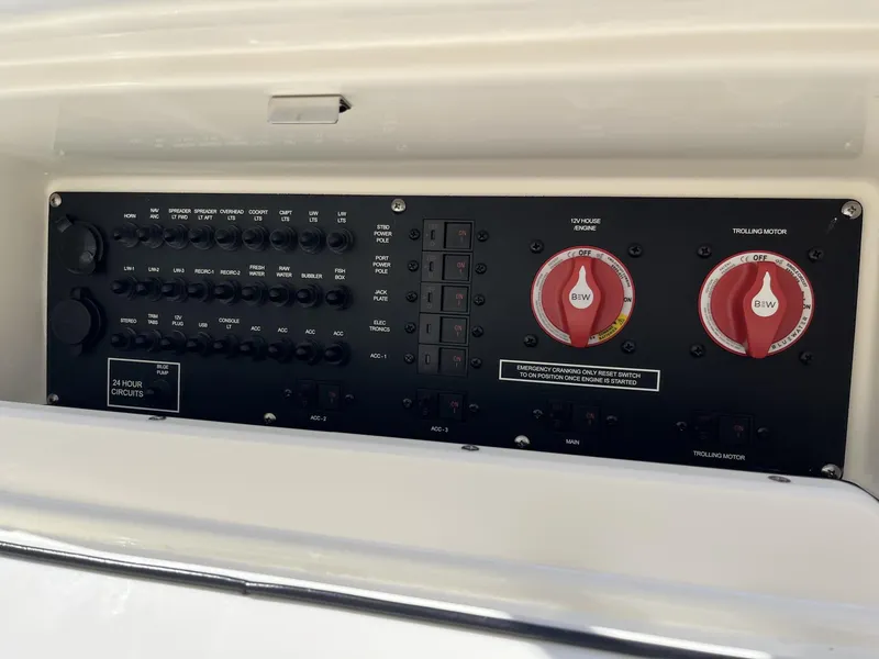 Slide: The Image of Control panel of 2025 Pathfinder 2300 HPS boat with switches and dials. - 23