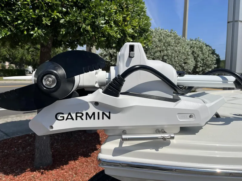 Slide: The Image of Garmin trolling motor on 2025 Pathfinder 2300 HPS boat, outdoors with greenery background. - 25