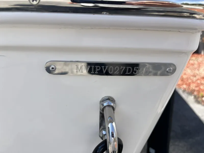 Slide: The Image of 2025 Pathfinder 2300 HPS boat hull identification number plate close-up. - 7