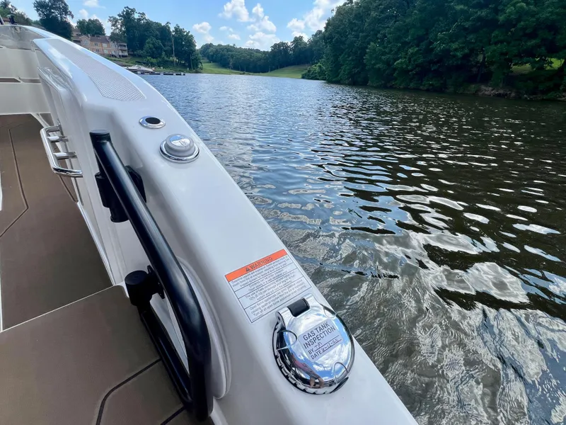 Slide: The Image of Navan C30 boat on a serene lake, showcasing sleek design and modern features, 2025 model. - 15