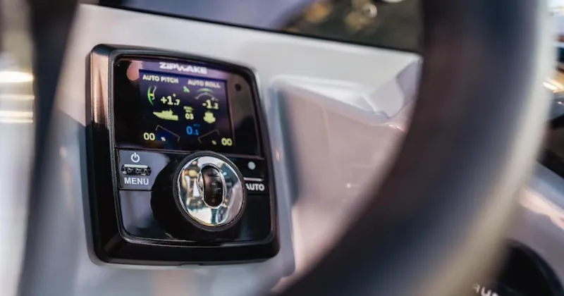 Slide: The Image of Control panel of 2025 Navan C30 with digital display and navigation controls. - 28