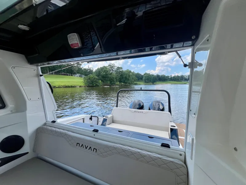 Slide: The Image of 2025 Navan C30 boat interior with lake view and twin engines. - 31