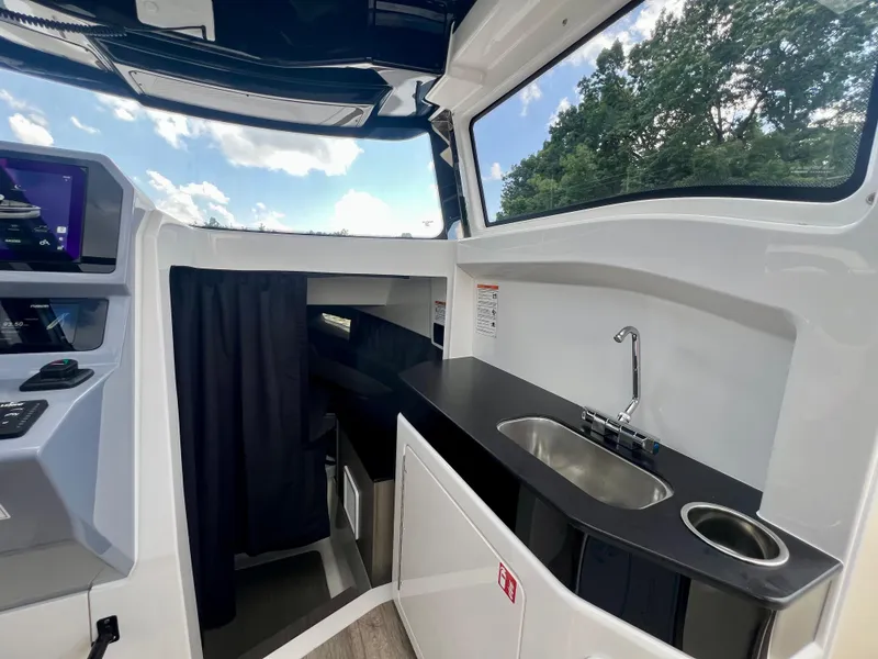 Slide: The Image of Interior of 2025 Navan C30 boat with sleek kitchenette and modern design. - 34