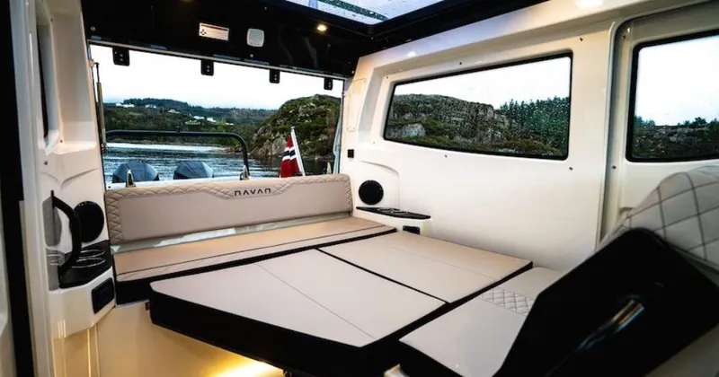 Slide: The Image of Interior of 2025 Navan C30 boat with modern seating and scenic window view. - 35