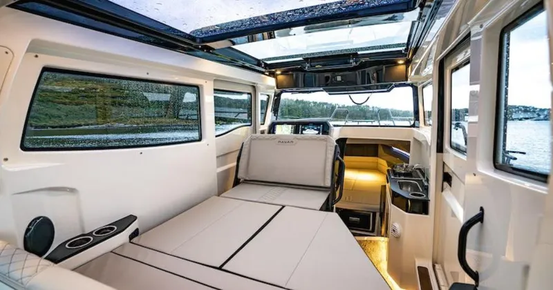 Slide: The Image of Interior of 2025 Navan C30 boat with modern seating and panoramic windows. - 36