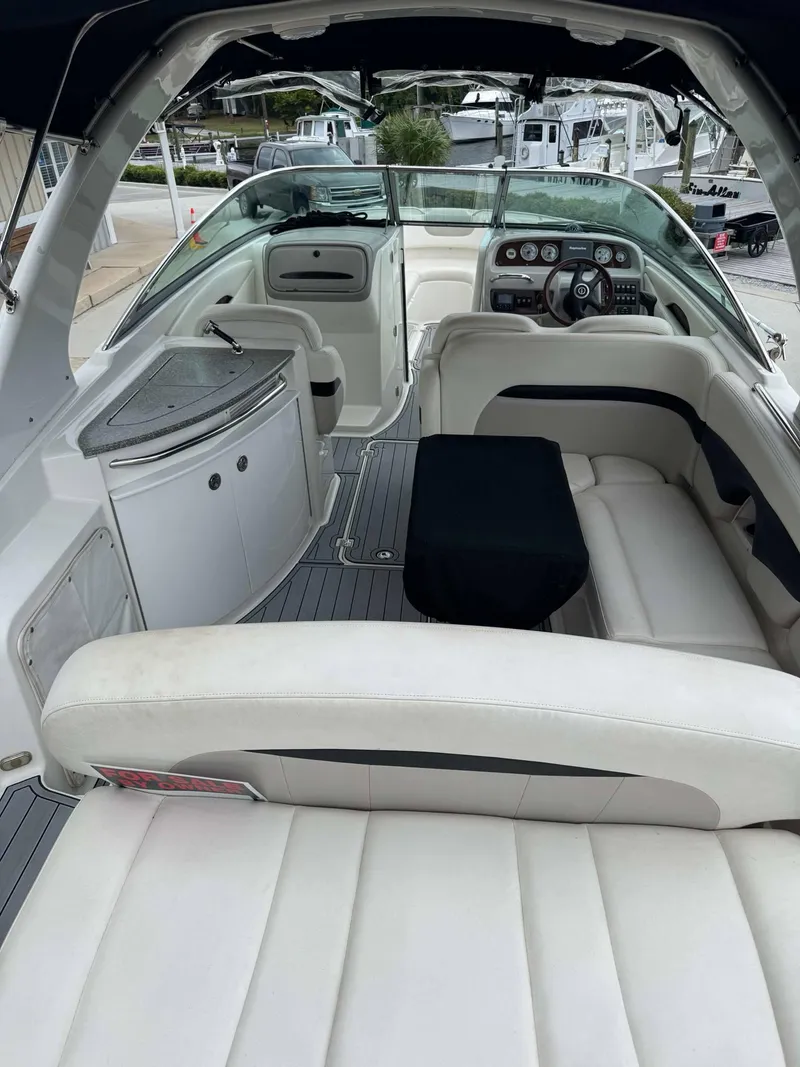 Slide: The Image of 2007 Chaparral SSX 276 boat interior with white seating and dashboard view. - 11