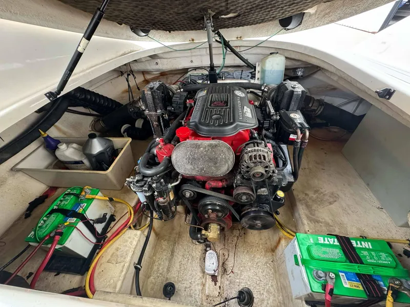 Slide: The Image of Engine compartment of a 2007 Chaparral SSX 276 boat, featuring batteries and mechanical components. - 13