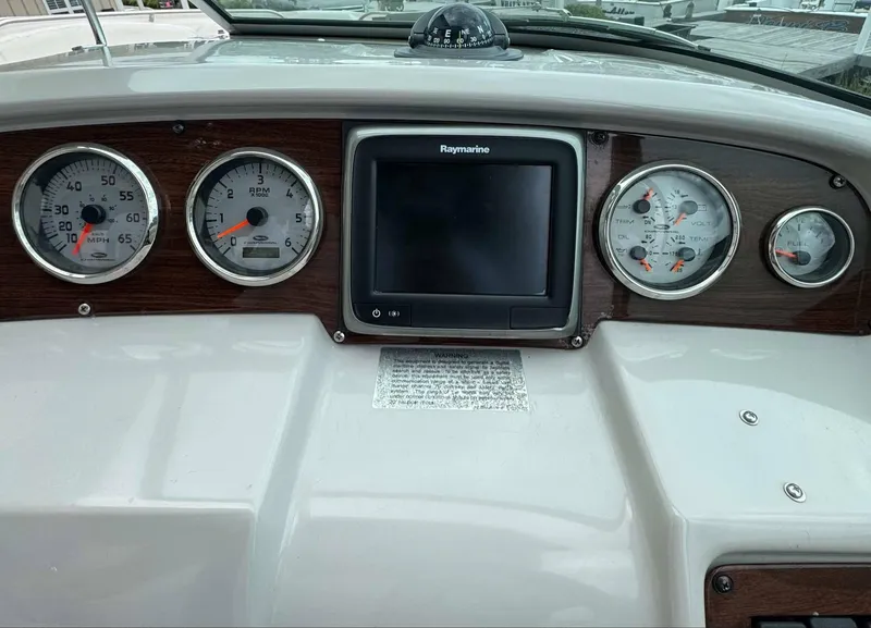 Slide: The Image of Dashboard of 2007 Chaparral SSX 276 boat with gauges and Raymarine display. - 24