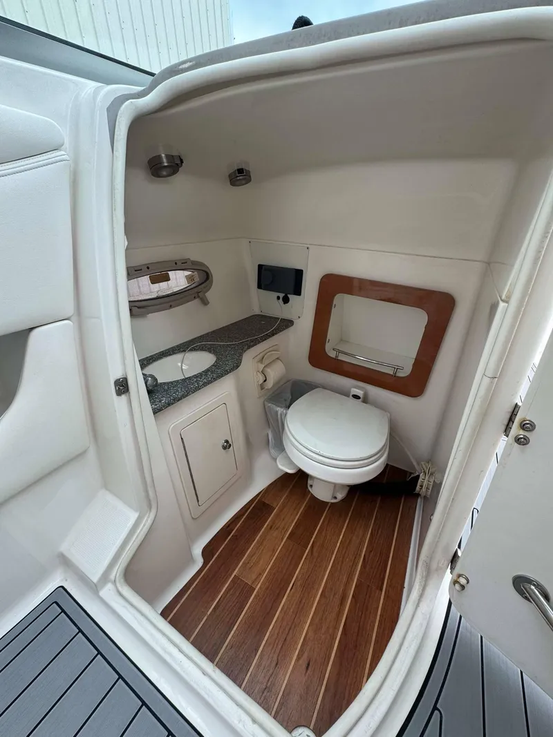 Slide: The Image of 2007 Chaparral SSX 276 boat bathroom with wood flooring and modern fixtures. - 29