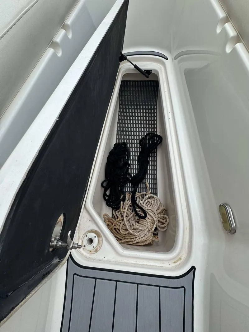 Slide: The Image of Open storage compartment on 2007 Chaparral SSX 276 boat with ropes inside. - 30