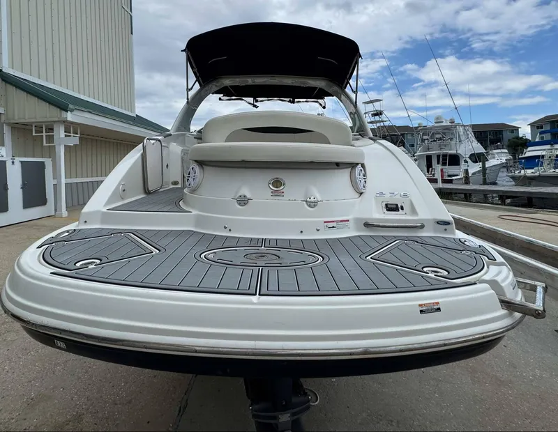 Slide: The Image of 2007 Chaparral SSX 276 boat at dock, rear view with swim platform. - 8