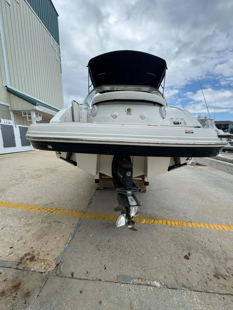 Slide: The Image of 2007 Chaparral SSX 276 boat docked at marina under cloudy sky. - 9