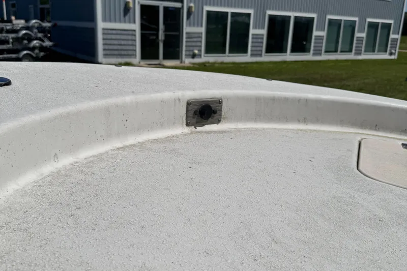 Slide: The Image of 2016 Carolina Skiff J16 boat deck with building in background. - 7