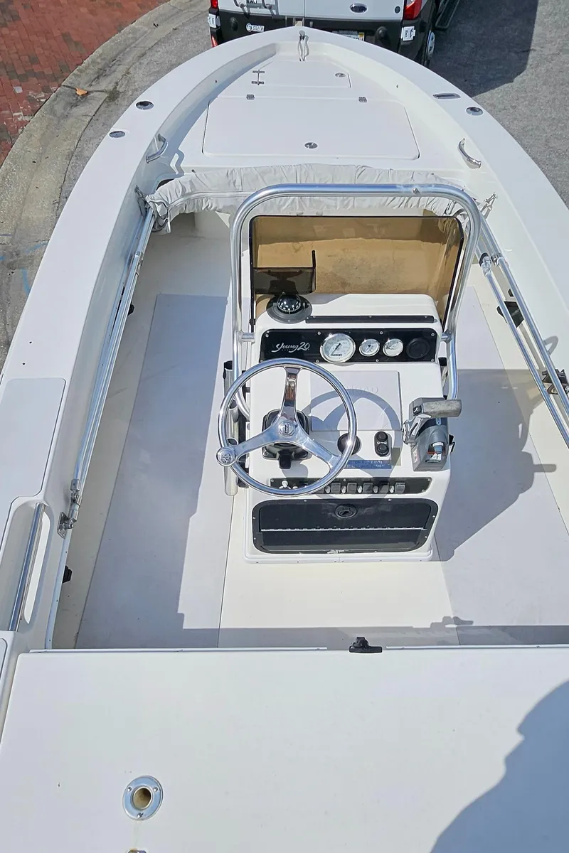 Slide: The Image of 2007 Young Boats 20 Bay, top view of steering console and deck. - 16