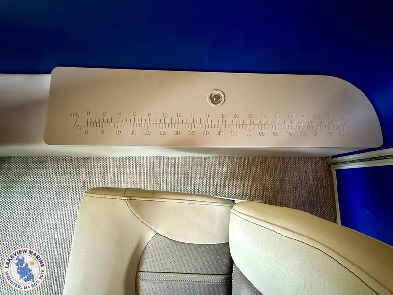 Slide: The Image of 2024 Bennington 20 SXSNP boat interior with measuring scale and beige seating. - 12