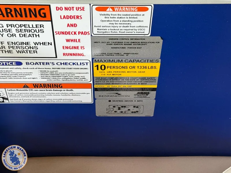 Slide: The Image of 2024 Bennington 20 SXSNP safety and capacity warning labels, maximum 10 persons or 1336 lbs. - 13