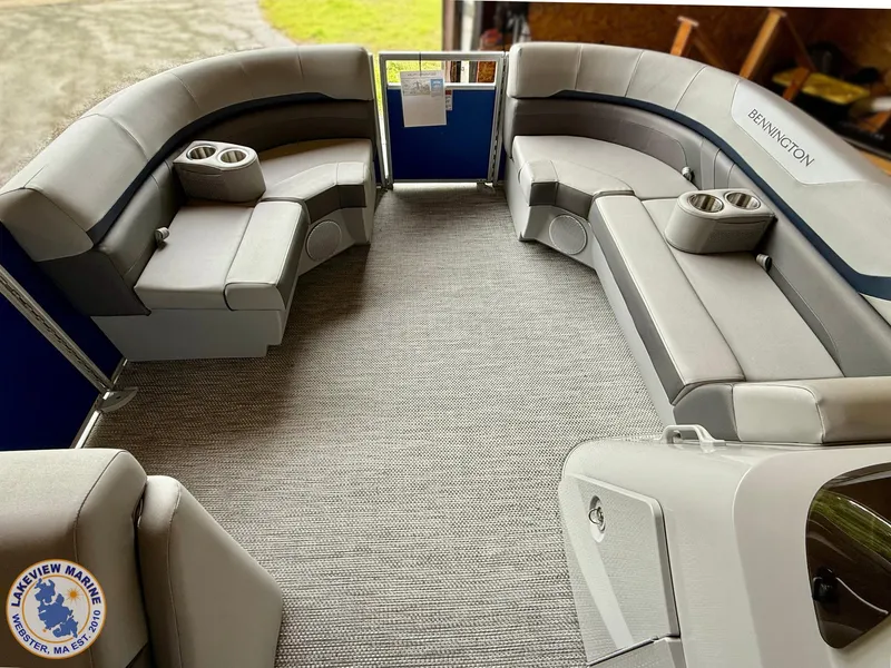 Slide: The Image of 2024 Bennington 20 SXSNP pontoon boat interior with plush seating and cup holders. - 2