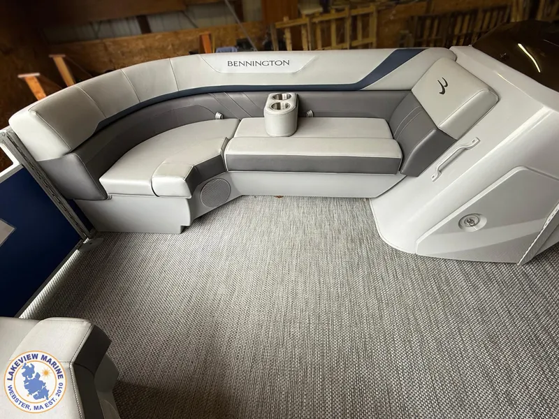 Slide: The Image of 2024 Bennington 20 SXSNP boat interior with gray seating and cup holder. - 3