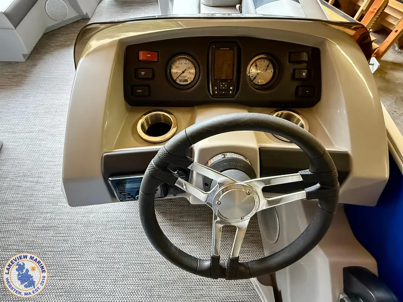 Slide: The Image of 2024 Bennington 20 SXSNP boat dashboard with steering wheel and gauges. - 5