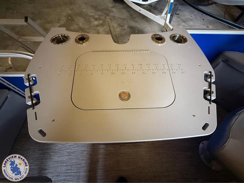 Slide: The Image of 2024 Bennington 20 SXSNP boat table with cup holders and measurement markings. - 9