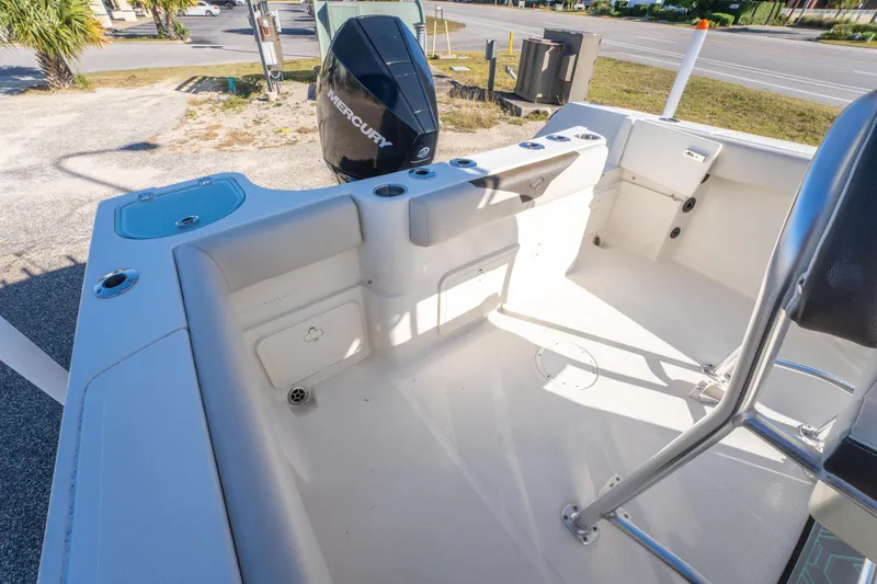 Slide: The Image of 2022 Sailfish 242CC boat interior with Mercury engine, featuring spacious deck and storage compartments. - 37