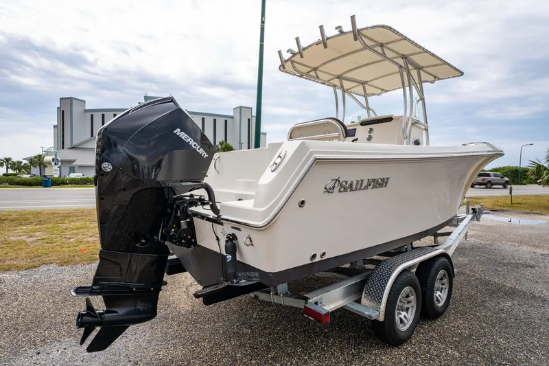 Slide: The Image of Pre-owned boat lot offering inspections, financing, accessories, and elite customer service. Sailfish 242CC 2022. - 7