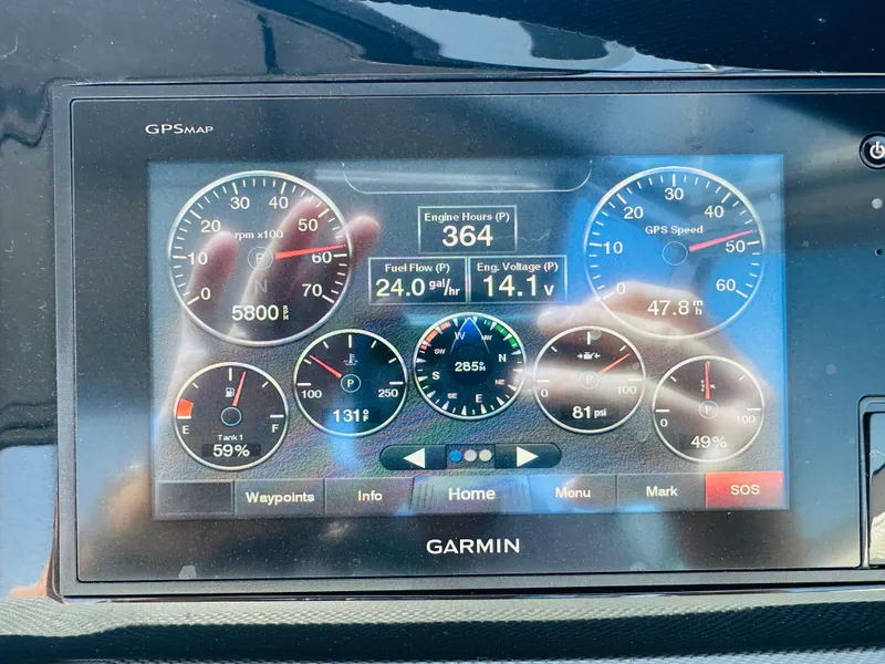 Slide: The Image of Garmin GPS display showing engine metrics on a 2018 Cobalt 23SC boat. - 25