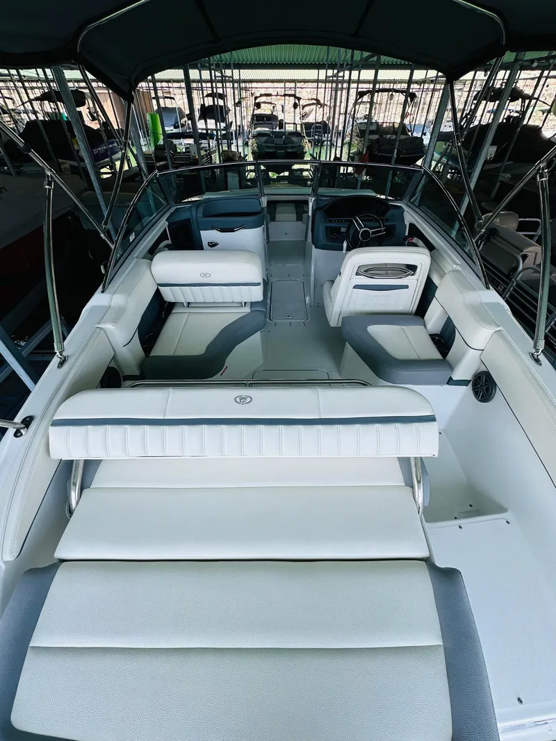 Slide: The Image of 2018 Cobalt 23SC boat interior with white seating and sleek design. - 30