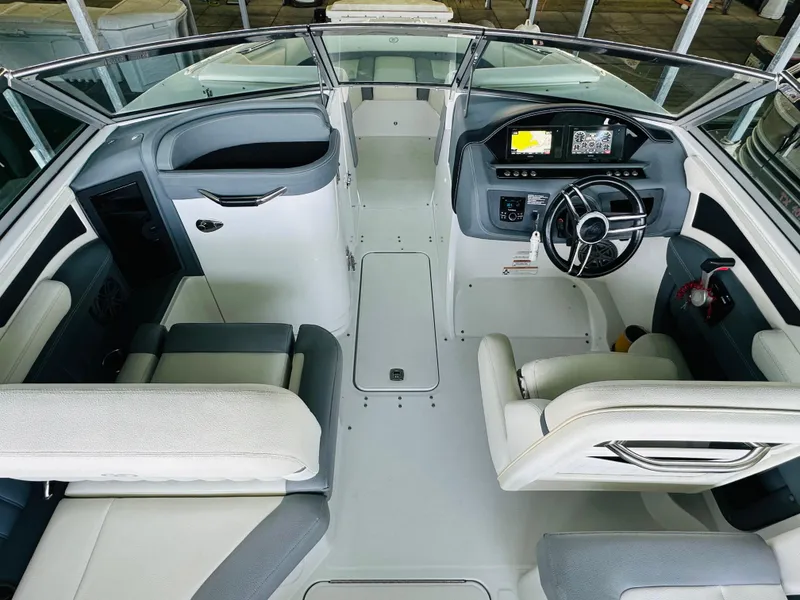 Slide: The Image of 2018 Cobalt 23SC boat interior with modern dashboard and seating arrangement. - 43