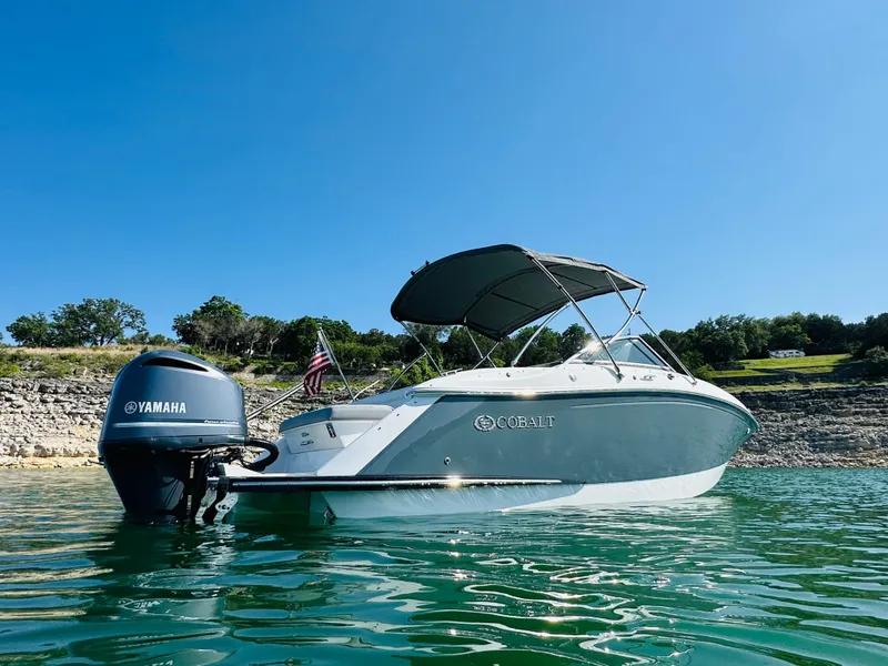 Slide: The Image of 2018 Cobalt 23SC boat with Yamaha engine on a sunny lake. - 7