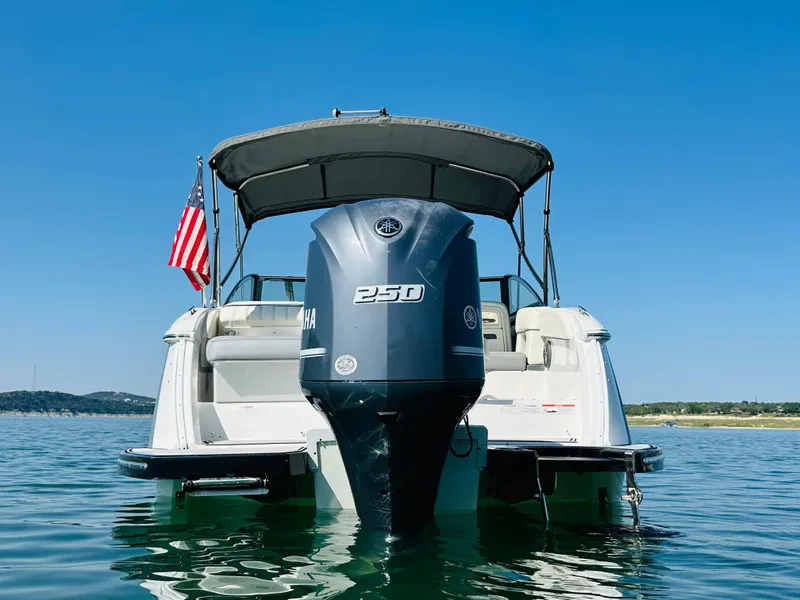 Slide: The Image of 2018 Cobalt 23SC boat with Yamaha 250 engine on a sunny lake. - 8