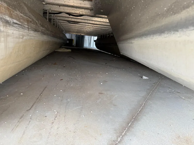 Slide: The Image of Underneath view of a 2014 Bennington 2550 RCB pontoon boat, showing pontoons and structure. - 10