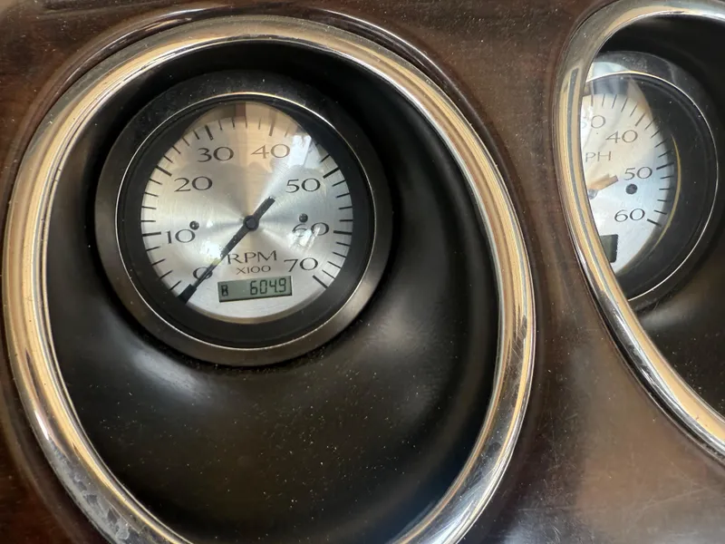 Slide: The Image of Dashboard gauges of a 2014 Bennington 2550 RCB boat, displaying RPM and hours. - 15