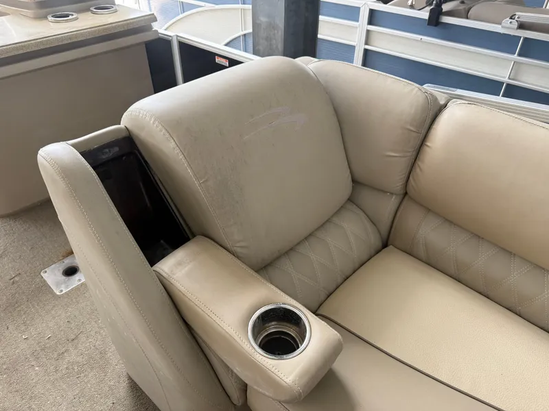 Slide: The Image of Beige leather seating with cup holder on a 2014 Bennington 2550 RCB boat. - 26