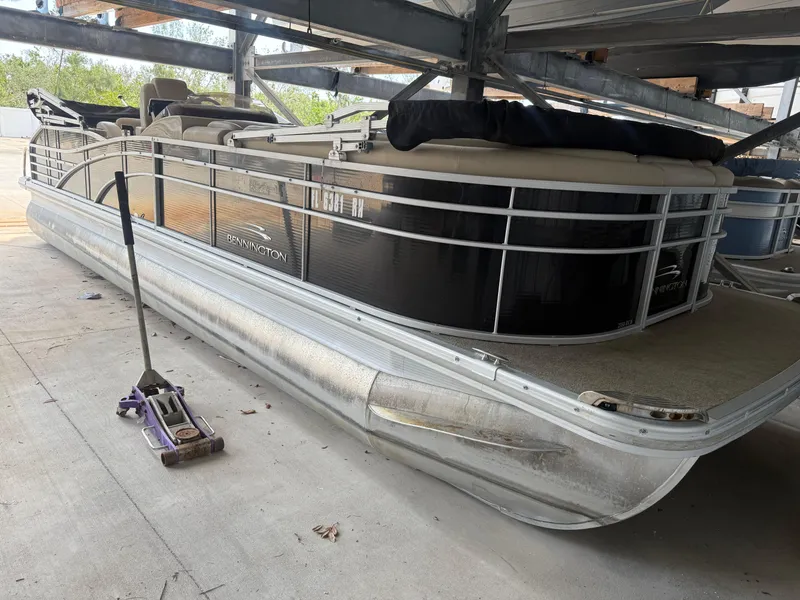 Slide: The Image of 2014 Bennington 2550 RCB pontoon boat in storage, side view. - 4