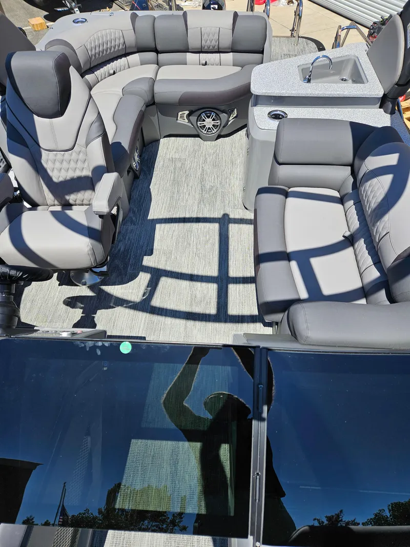 Slide: The Image of Luxurious interior of 2025 Avalon Excalibur LTD Elite Windshield 27FT boat with plush seating. - 4