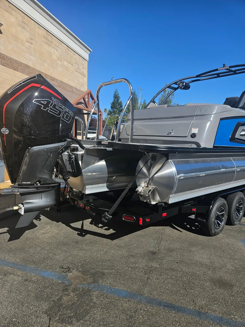 Slide: The Image of 2025 Avalon Excalibur LTD Elite Windshield 27FT boat with powerful outboard motor. - 5