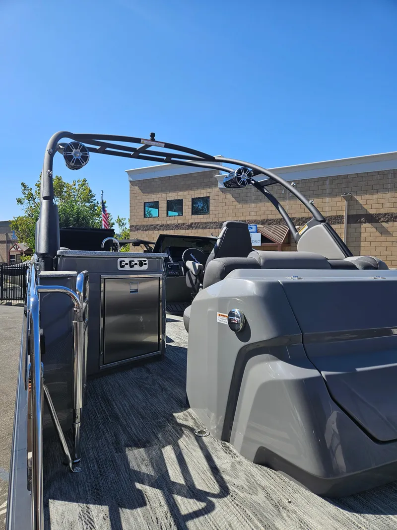 Slide: The Image of 2025 Avalon Excalibur LTD Elite Windshield 27FT boat with sleek design and modern features. - 7