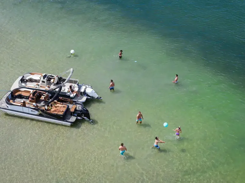 Slide: The Image of Aerial view of people enjoying water near a 2025 Tahoe LTZ boat. - 20