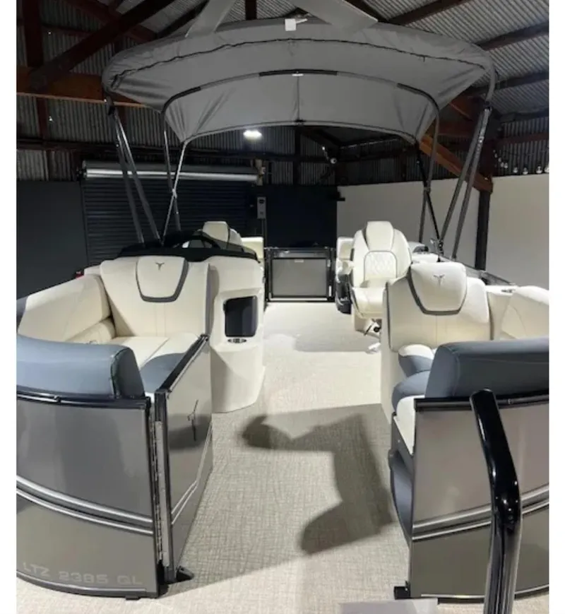 Slide: The Image of 2025 Tahoe LTZ pontoon boat interior with canopy, featuring luxurious seating and modern design. - 5