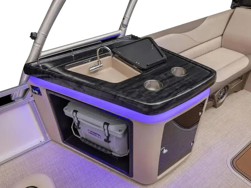 Slide: The Image of Luxurious 2025 Tahoe LTZ boat interior with sink, cooler, and ambient lighting. - 9